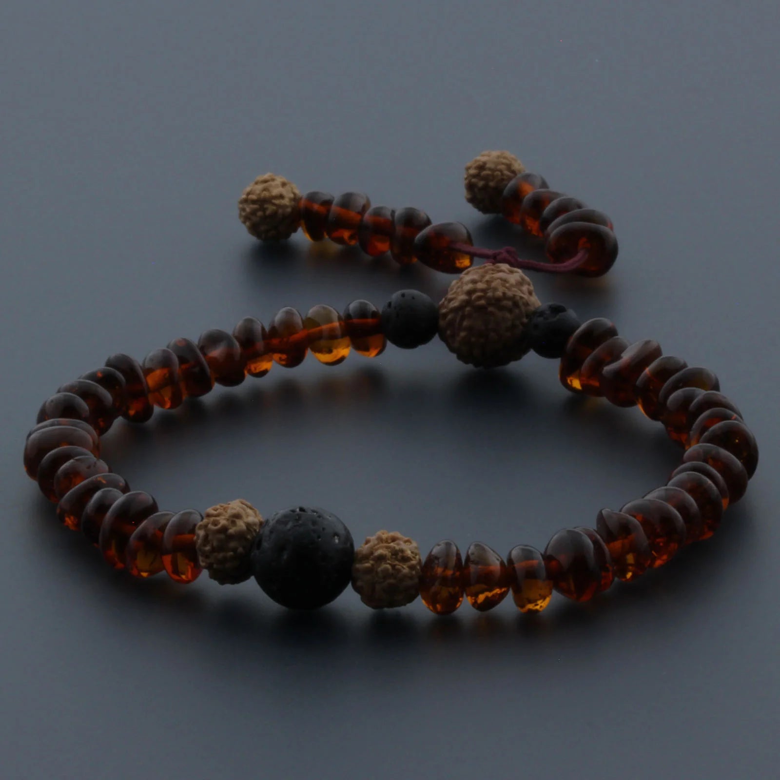 Adult Baltic Amber Bracelet with Lava Stone Mala Tassel. MS01