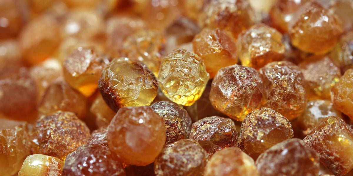 Close-up of amber-colored gemstones with a soft focus